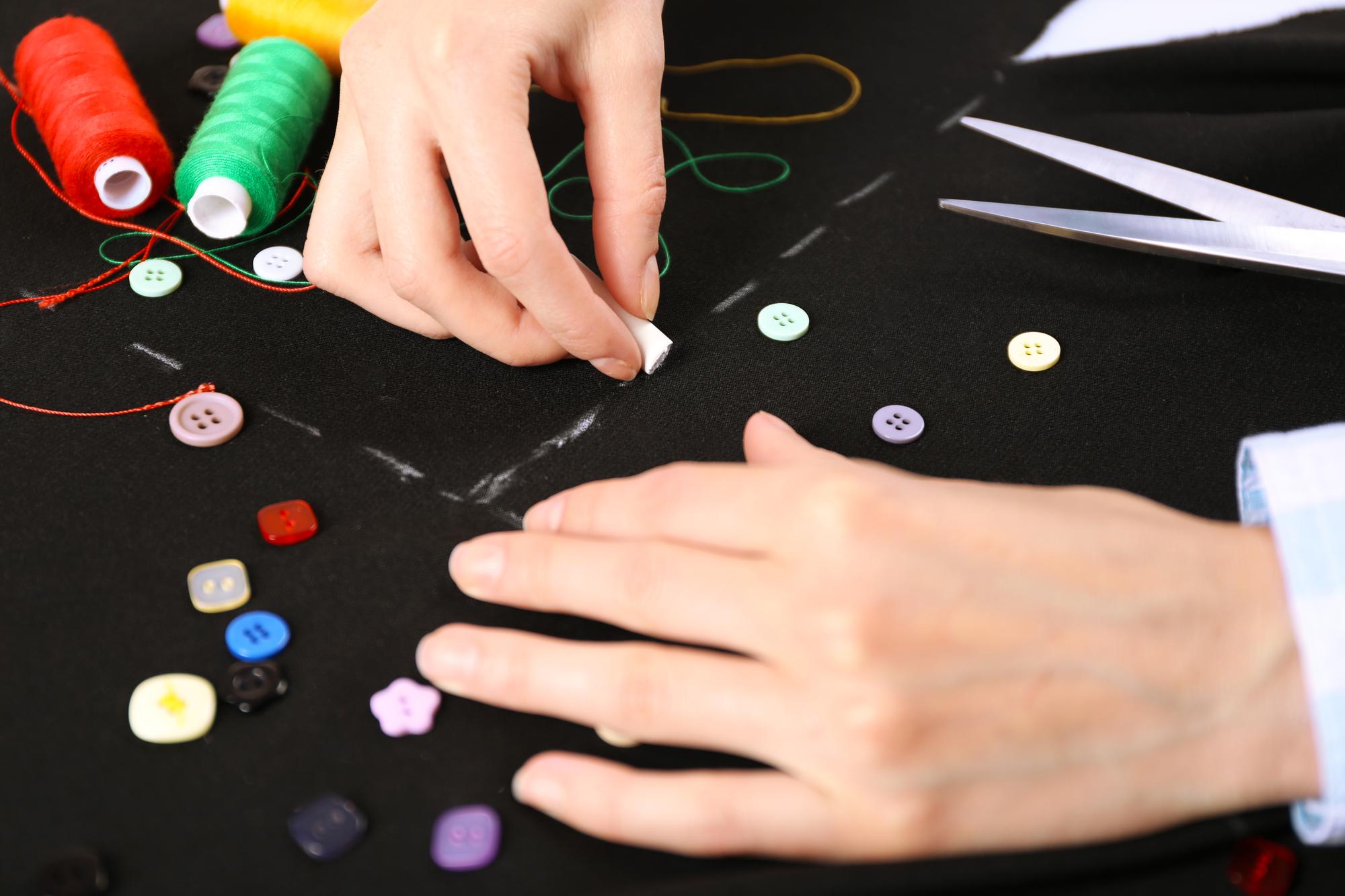 Workshop table with threads and embroidered patches